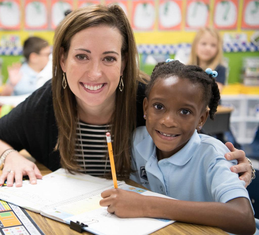 Teacher and kid smiling